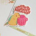 Hand-drawn sticker with the text 'Coffee Plz' and a cozy illustration.