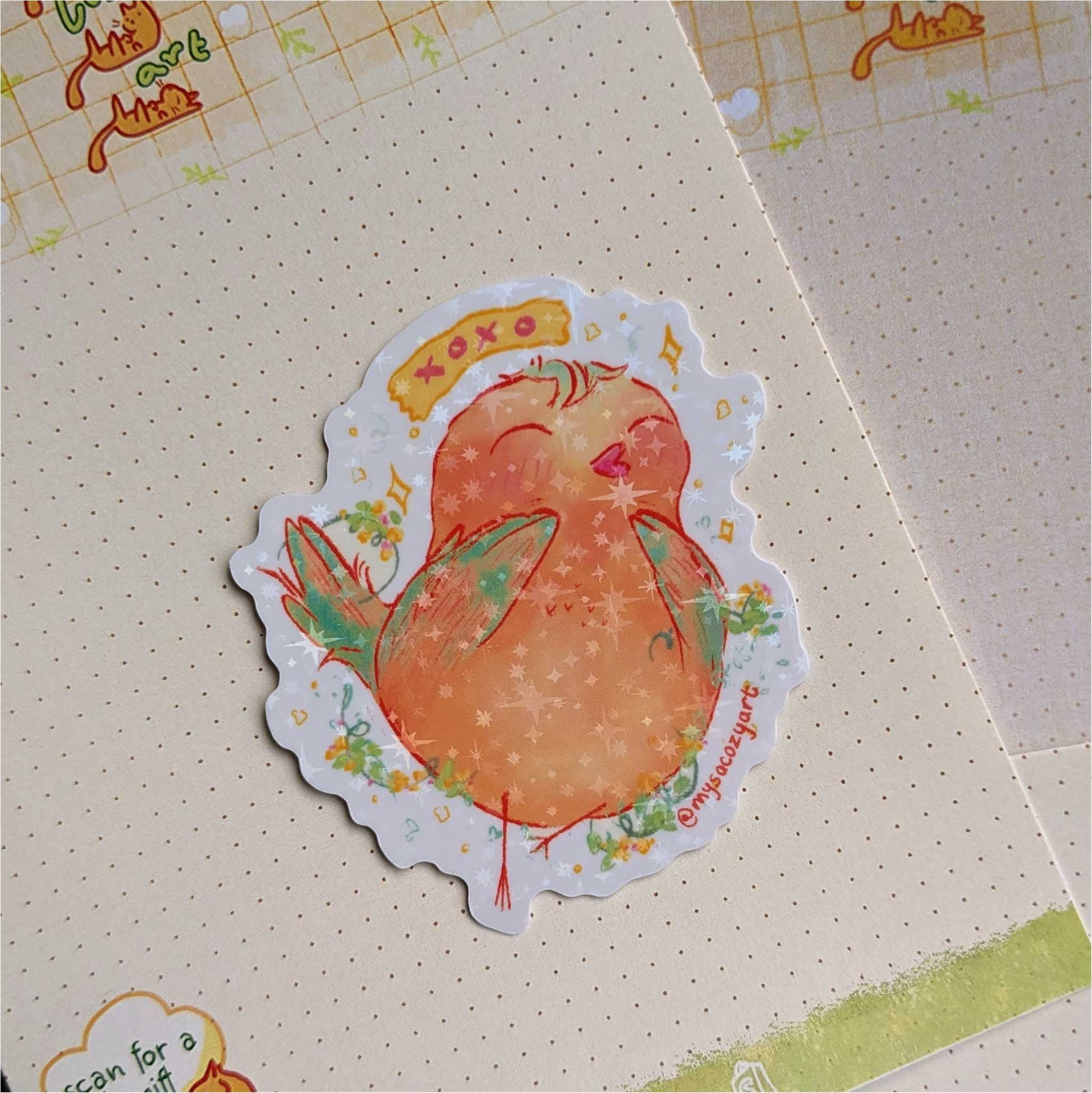 A simple, hand-drawn illustration of a round, fluffy bird in a soft matte die-cut sticker.