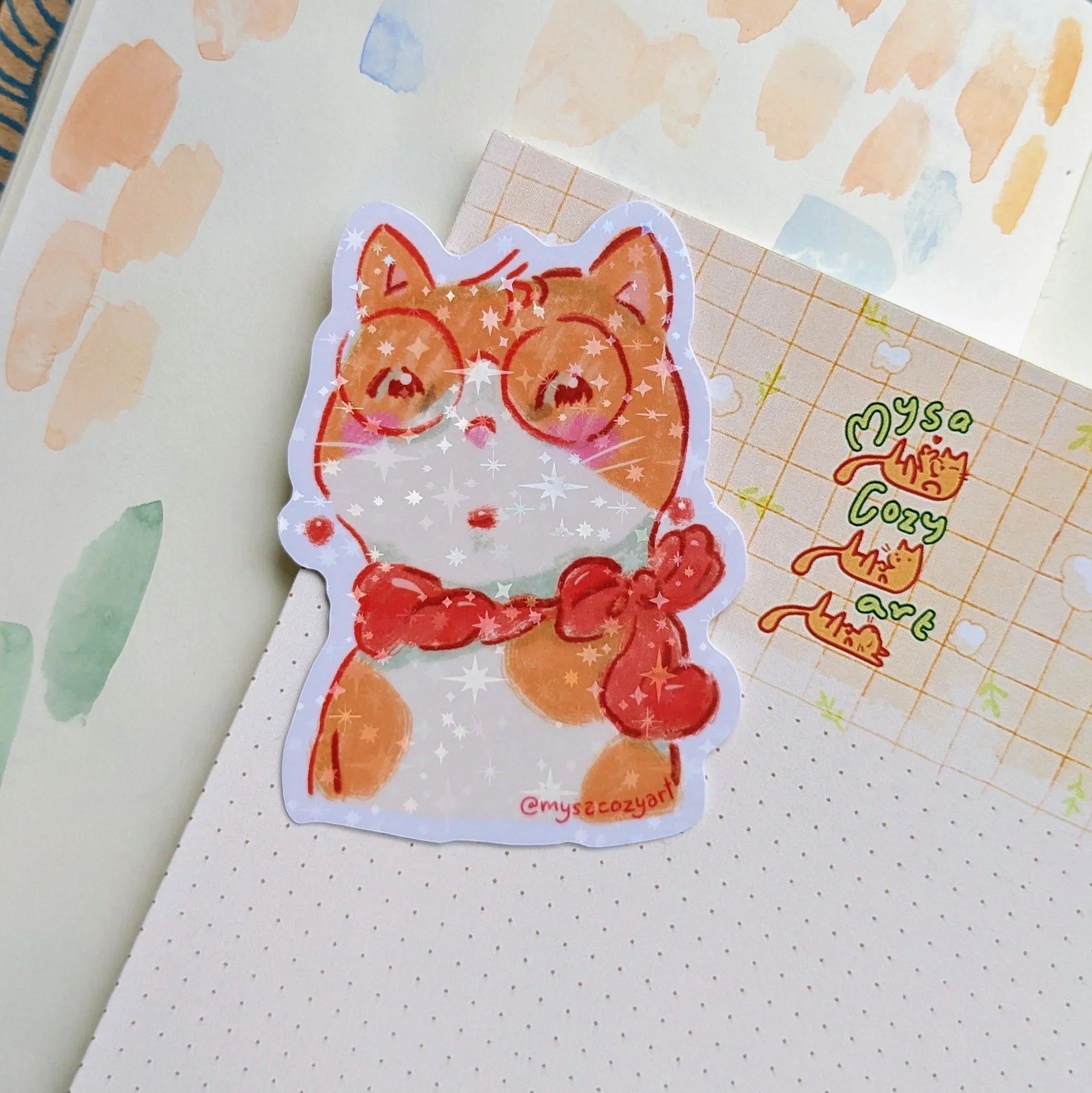 A stylish cat wearing gold earrings and thick-rimmed glasses, illustrated in a cozy matte vinyl sticker style.