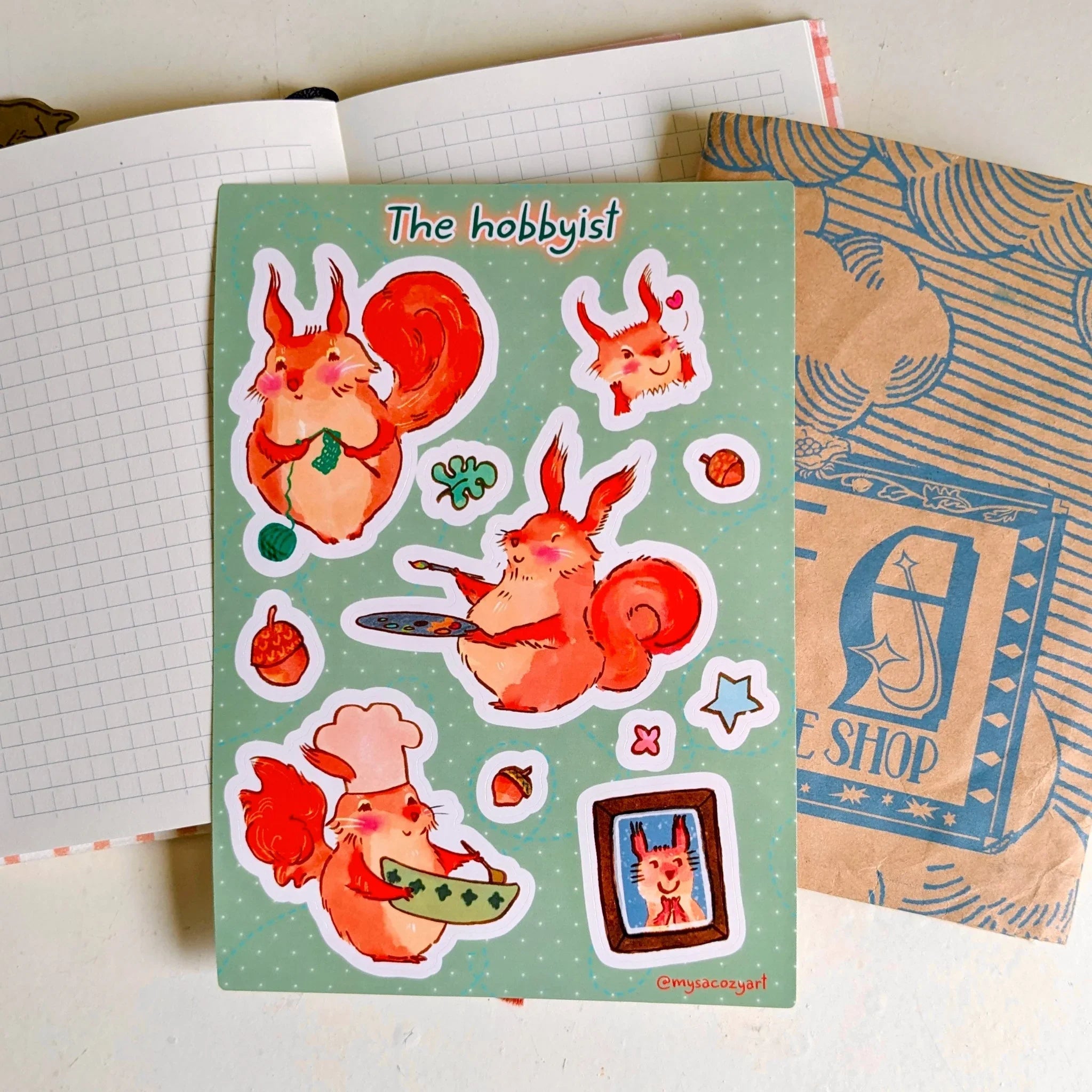 Animal Sticker sheet with illustrations of a cozy red squirrel painting on an easel, wearing an apron to cook, and knitting with yarn.